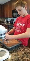 21-Kenny_writing_Happy_Birthday_on_a_cake_for_Grandpa_Duke_since_they_are_visiting