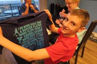 12-Kenny_shows_off_another_shirt_he's_happy_to_receive