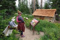 31-admiring_an_old_cabin_from_the_original_Cedar_Breaks_Lodge