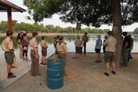 13-receiving_orientation_from_swim_friend_Logan_for_his_Eagle_Scout_project_to_replace_fishing_line_receptacle_in_Sunset_Park