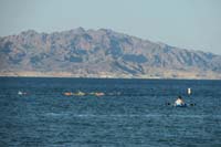 40-Kenny_and_his_teammates_swimming_with_amazing_distant_mountain_views