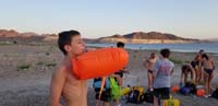 18-filling_up_his_buoy_for_open_water_swim_practice_at_630am