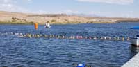 16-kids_lined_up_to_start-Kenny_is_green_cap_in_middle,spectators(Daddy)_in_distance_far_right