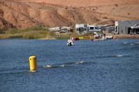75-Kenny_in_the_green_cap_in_the_foreground,finish_line_looks_inviting,but_he_has_to_go_around_two_more_times-1128am