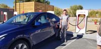 02-Kenny_happy_to_plug_the_Tesla_into_it's_first_supercharge_in_Beatty,NV