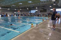 017-Kenny_warming_up_for_first_race-head_of_Sandpipers_watching_over-Kenny's_future_Coach_Ron