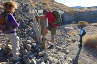 02-climbing_over_the_fence-lots_of_extra_graffiti