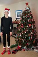 03-Kenny_has_the_Santa_hat_on_so_he's_now_ready_to_open_gifts