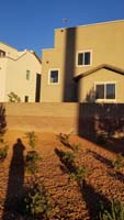 14-Kenny_waving_through_2nd_floor_landing_window_as_seen_from_behind_house