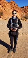 07-Kenny_showing_off_his_stash_of_rocks_in_his_hat_and_sweatshirt_pouch-also_hood_and_backpack