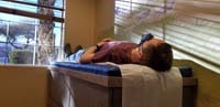 01-Kenny_lays_on_the_doctor's_table_for_his_high_school_swim_team_physical