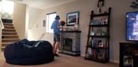 11-multi-tasking_Kenny,watching_Youtube_videos_on_his_tablet_while_dusting_the_house_as_part_of_helping_to_clean_the_house