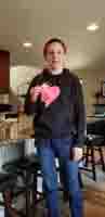 15-showing_off_a_valentine_he_received_at_school