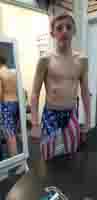 17-Kenny_trying_on_his_new_tech_suit_at_Bodyline_Swim_Shop