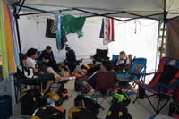 46-Day_2-kids_hanging_out_outside_in_their_own_tent_area-830am