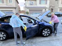 06-Kenny_helping_Mommy_wash_the_Tesla-he's_so_helpful