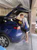 12-Kenny_loading_up_the_swim_gear_for_practice
