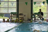 15-now_they_warm-up_by_swimming_laps_in_the_pool_per_Coach_Jake's_instructions