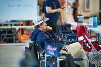 18-Coach_Jake_is_deep_in_thought_watching_the_kids_warm_up_in_the_pool-from_Jo